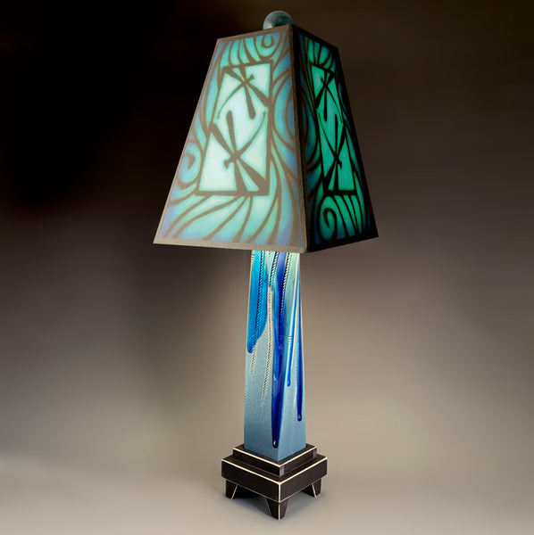 Blue Dragonfly handmade ceramic table lamp with twisted blue extruded clay base, illuminated pictograph dragonfly shade by Michael Macone, made in Shell Lake Wisconsin