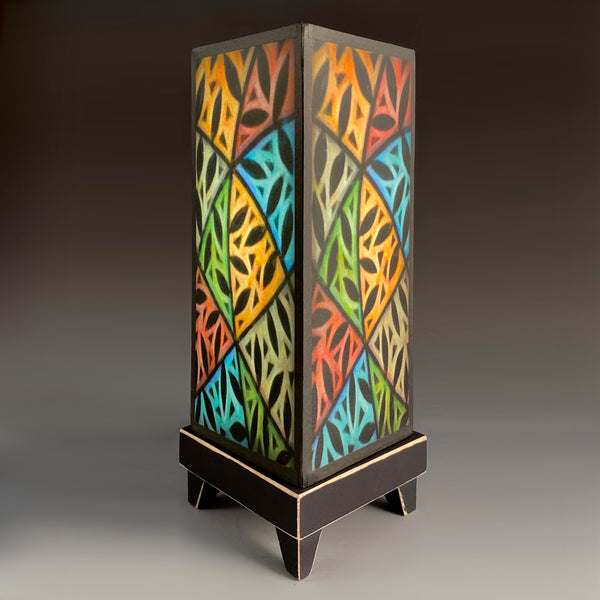 Colorful Vines mood lamp lit and glowing with stained-glass style paper shade