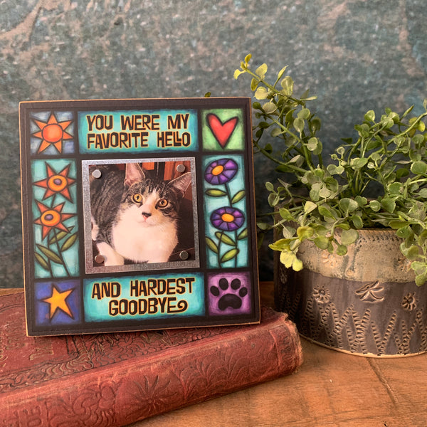 Pet memorial picture frame on shelf with favorite hello hardest goodbye quote, colorful artwork and small 2x2 photo, sympathy gift for dog or cat loss