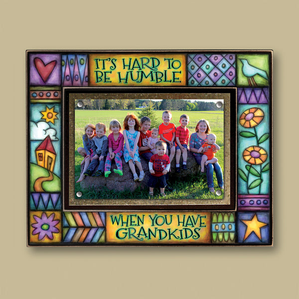 Grandkids picture frame with the quote It’s hard to be humble when you have grandkids featuring colorful Michael Macone artwork and a 4x6 photo opening.