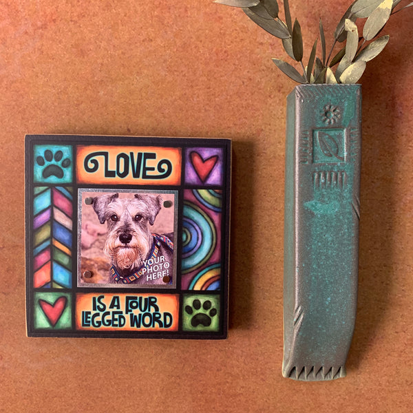 Dog lover picture frame on wall with Love is a four legged word quote and colorful artwork, meaningful gift for dog or pet lovers