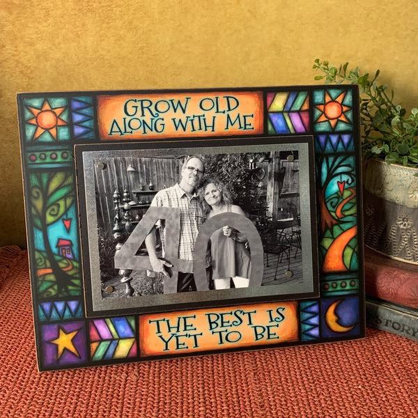 Romantic anniversary picture frame with Grow Old Along With Me quote displayed on shelf with Michael Macone artwork