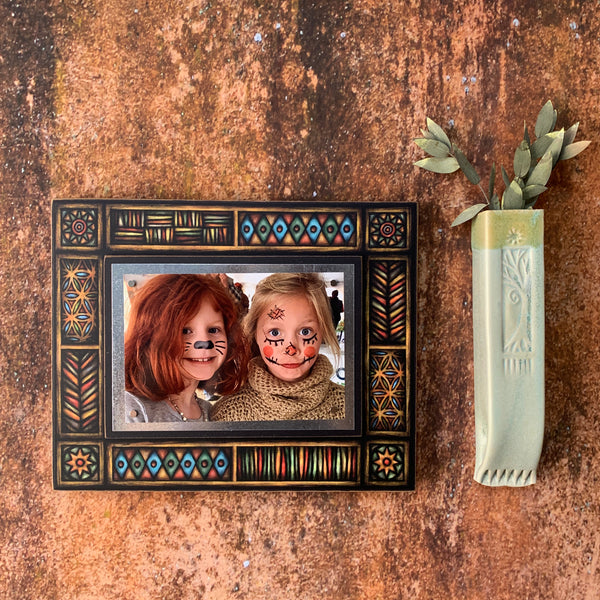 Brown Motif 4x6 picture frame by Macone Clay displayed in earth tone home decor setting, warm wood shelf and neutral interior style