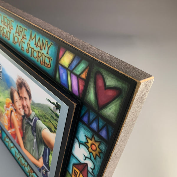 Top corner detail of Macone Clay love picture frame featuring colorful Michael Macone artwork and wood frame edge