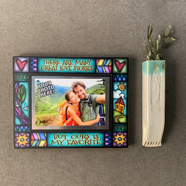 Love picture frame with quote “there are many great love stories but ours is my favorite” displayed on wall decor