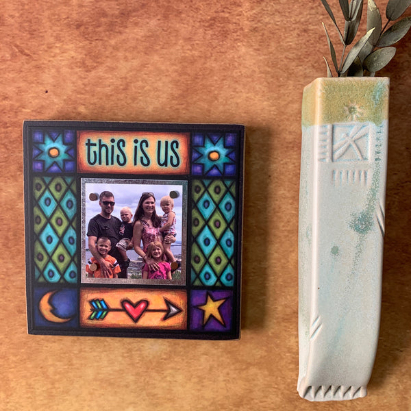 Mini picture frame with quote This Is Us hanging on wall, colorful Michael Macone artwork, Macone Clay