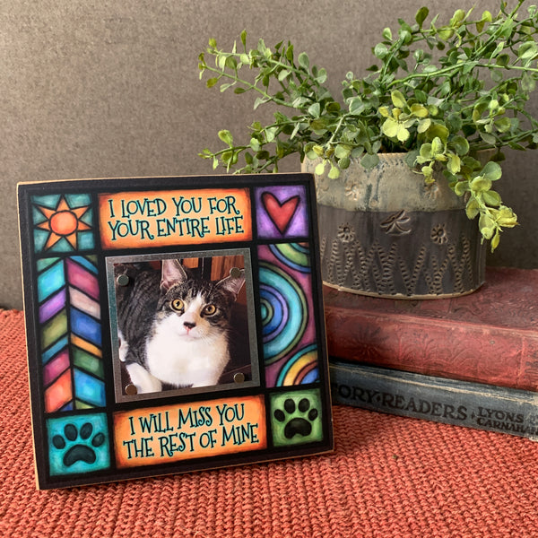 Pet memorial picture frame with I loved you for your entire life quote displayed on shelf, Michael Macone artwork with magnetic photo display for pet loss gift