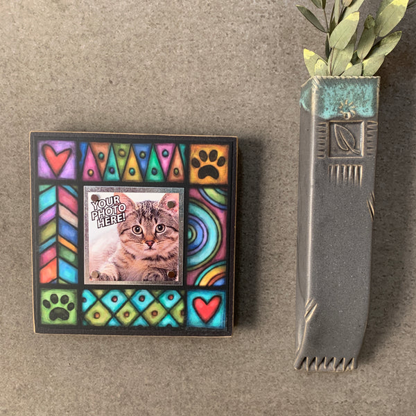 Wall display of pet picture frame with paw print design, Michael Macone artwork and magnetic photo display in small square format for dog and cat decor