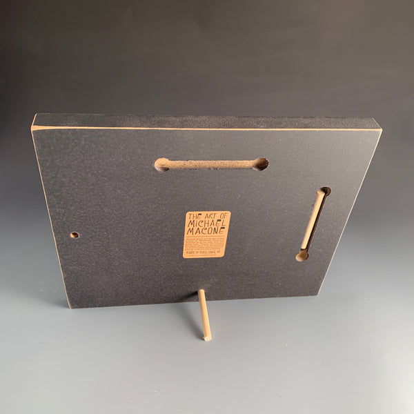 Back of Sisters Share the Journey Macone Clay picture frame showing peg stand and wall hanging option for tabletop or wall display