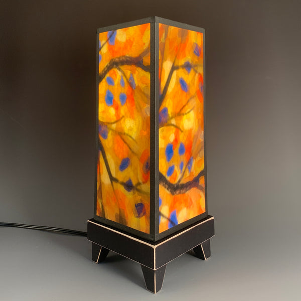 Stained Tree mood lamp lit in a bright, naturally lit room