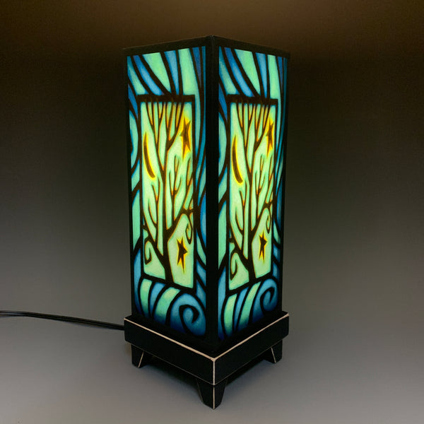 Star Tree mood lamp lit with room lights off, showing cool starry glow