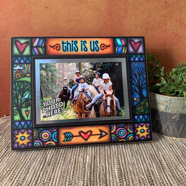 This Is Us 8x10 wood picture frame displayed on shelf with 4x6 photo and warm home decor background