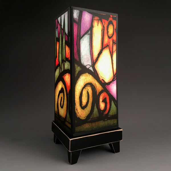 Tree Hill mood lamp glowing with stained-glass sunset paper shade