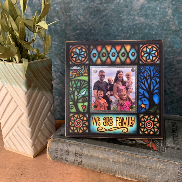 We Are Family mini picture frame styled in a home setting with a 2x2 family photo